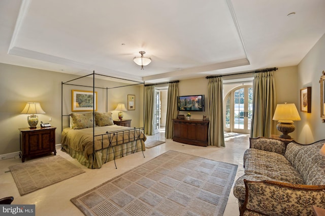 bedroom with a tray ceiling