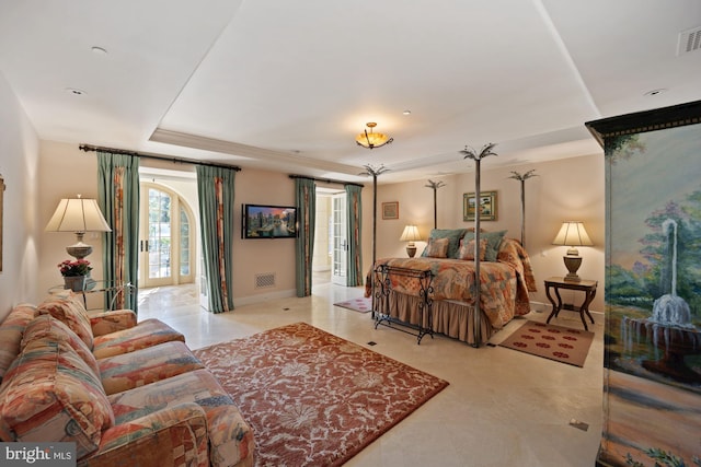 bedroom featuring a raised ceiling