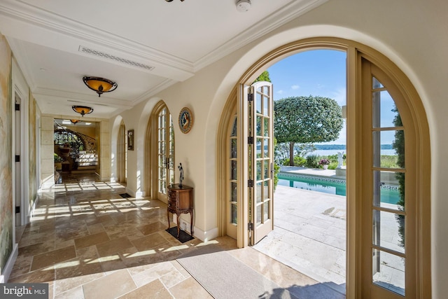 interior space featuring french doors and crown molding