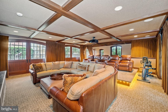 carpeted living room featuring beam ceiling, plenty of natural light, a textured ceiling, and coffered ceiling