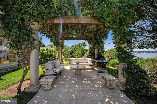 view of patio featuring a water view and an outdoor hangout area