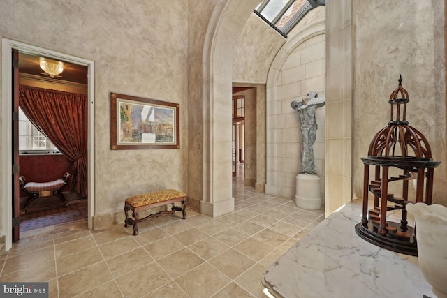 hallway featuring light tile patterned floors