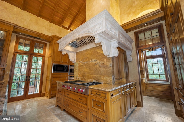 kitchen with stainless steel appliances, wooden ceiling, beamed ceiling, high vaulted ceiling, and french doors