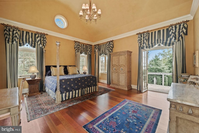 bedroom with dark hardwood / wood-style flooring, multiple windows, ornamental molding, and access to exterior