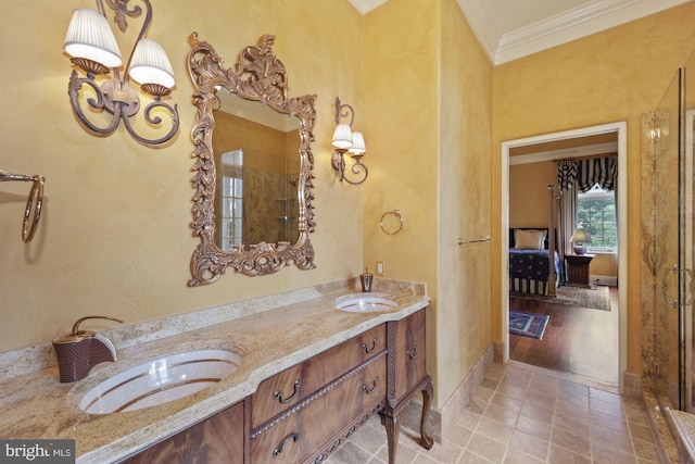 bathroom with vanity, wood-type flooring, and crown molding