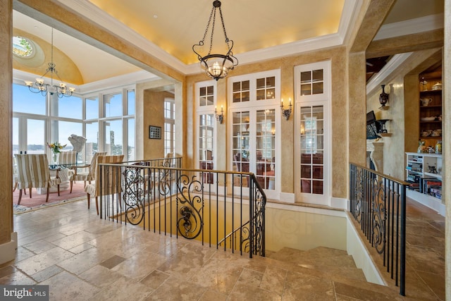 interior space with a notable chandelier and ornamental molding