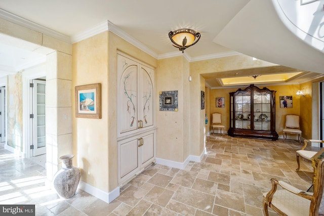 foyer featuring crown molding