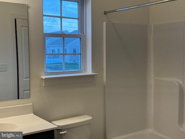 full bathroom featuring shower / bathing tub combination, vanity, and toilet