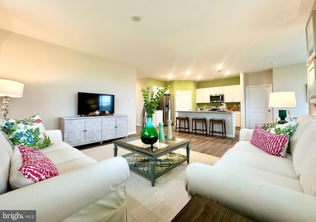 living room with light hardwood / wood-style floors