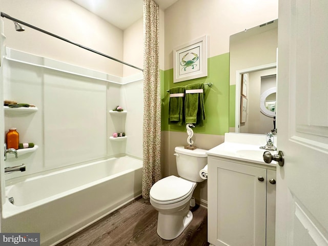 full bathroom with toilet, vanity, hardwood / wood-style flooring, and shower / bathtub combination with curtain