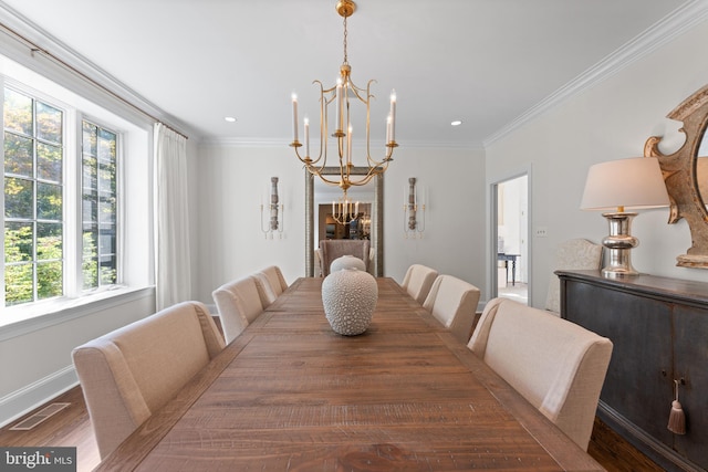 dining space with an inviting chandelier, dark hardwood / wood-style floors, and ornamental molding