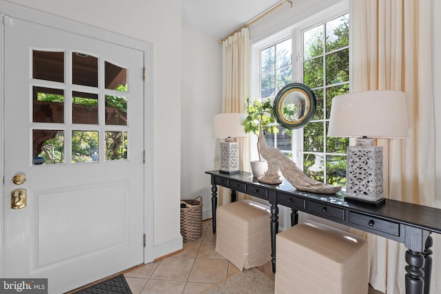 entryway featuring light tile patterned flooring