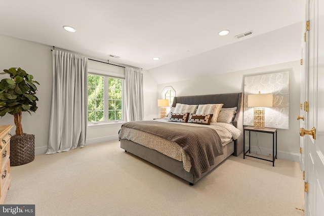 carpeted bedroom with vaulted ceiling