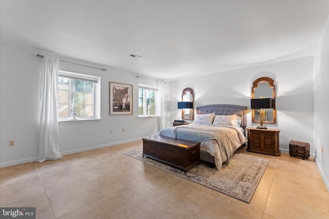 bedroom featuring light tile patterned floors