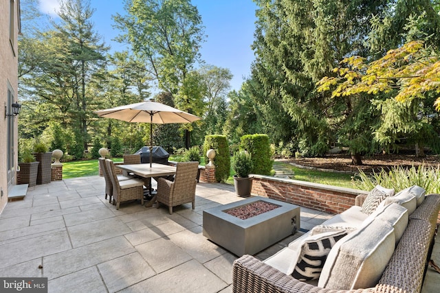 view of patio / terrace with an outdoor fire pit