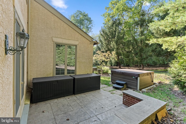 view of patio / terrace featuring a hot tub