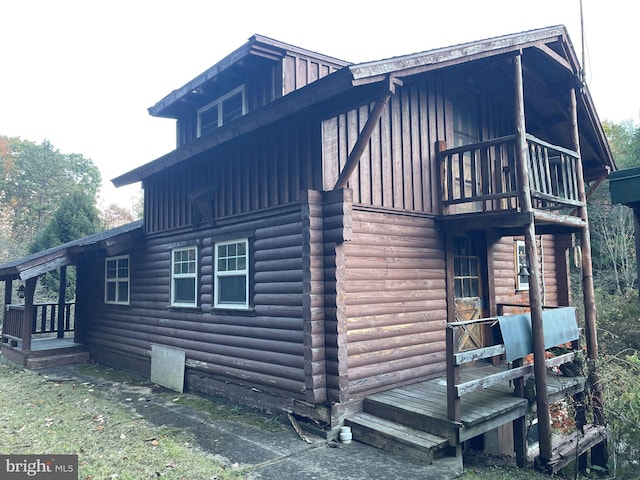 view of property exterior featuring a deck