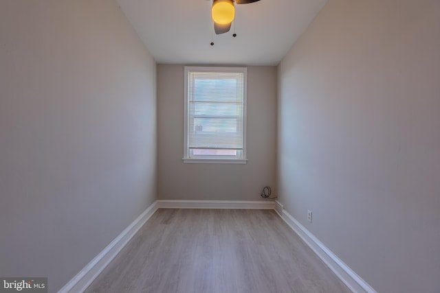 spare room with light wood-type flooring and ceiling fan