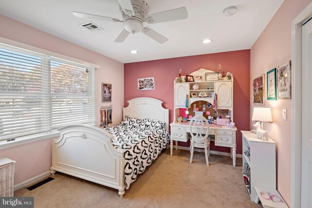 bedroom with ceiling fan and light colored carpet