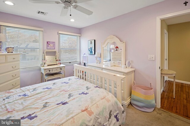 bedroom featuring ceiling fan and light hardwood / wood-style flooring