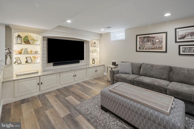 living room with light hardwood / wood-style flooring