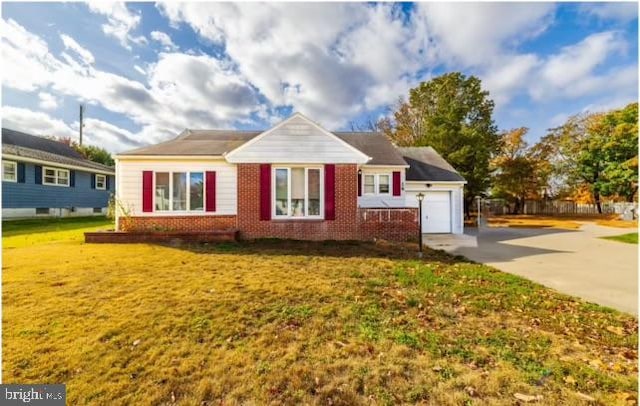 view of front of home with a garage and a front yard