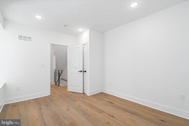 spare room featuring light hardwood / wood-style flooring