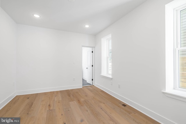 unfurnished room featuring light hardwood / wood-style flooring