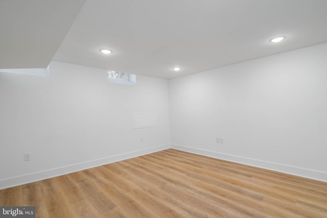 unfurnished room with light wood-type flooring