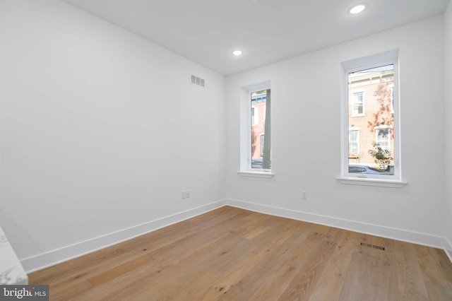 spare room with light hardwood / wood-style floors