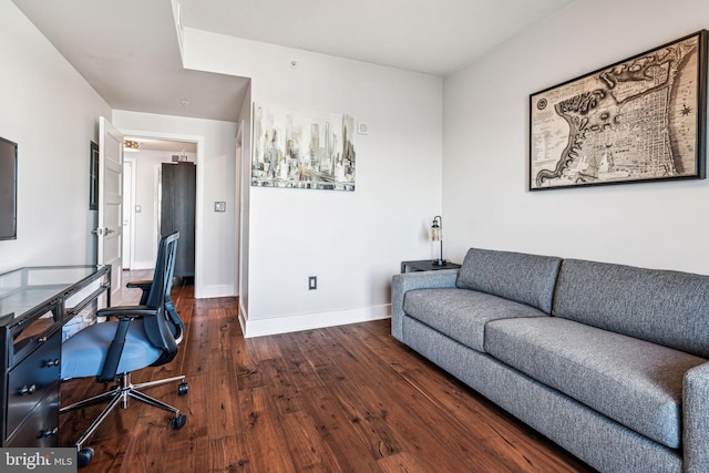 office with dark hardwood / wood-style floors