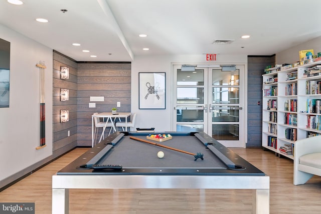 game room with hardwood / wood-style flooring, wooden walls, and billiards