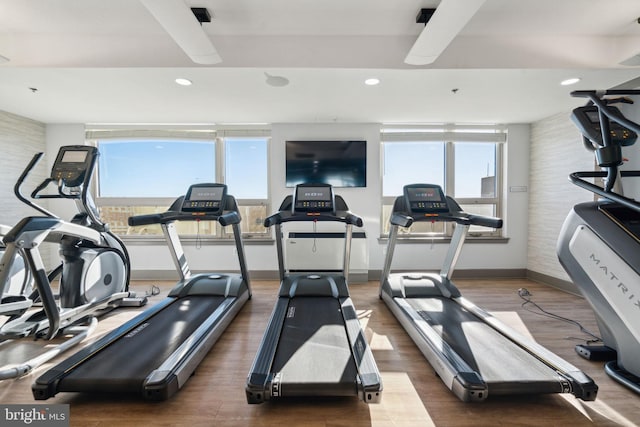 workout area featuring hardwood / wood-style floors