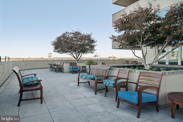 view of patio / terrace featuring an outdoor living space and exterior bar