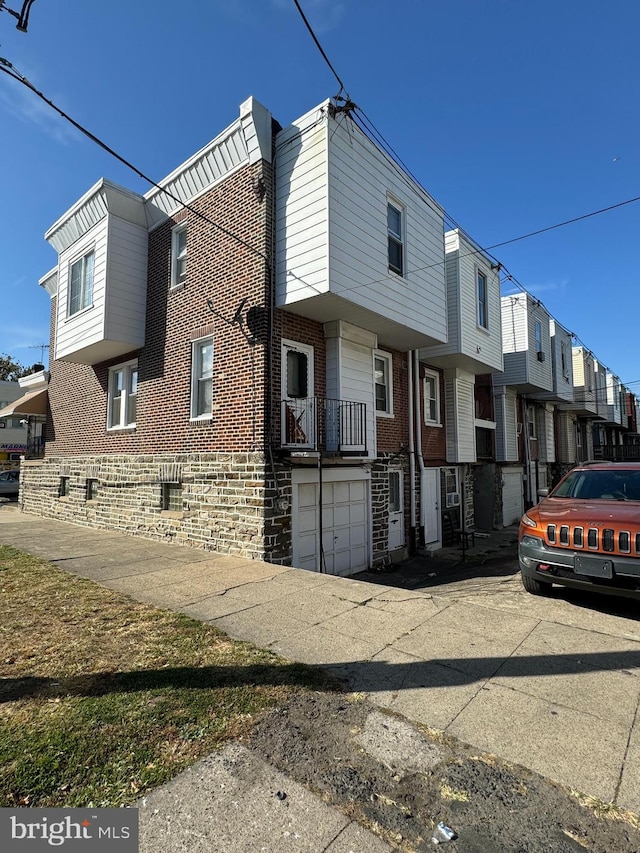 view of side of property with a garage