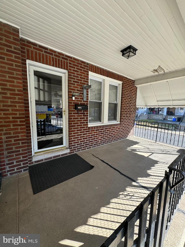 entrance to property with a patio