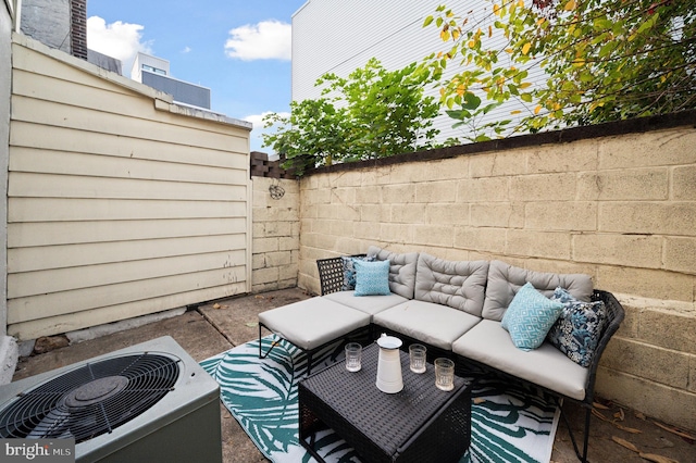 view of patio / terrace featuring an outdoor living space and central AC