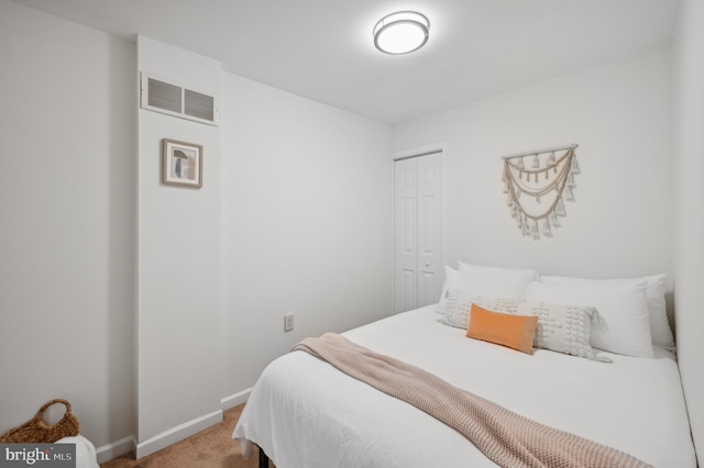 bedroom with carpet floors and a closet