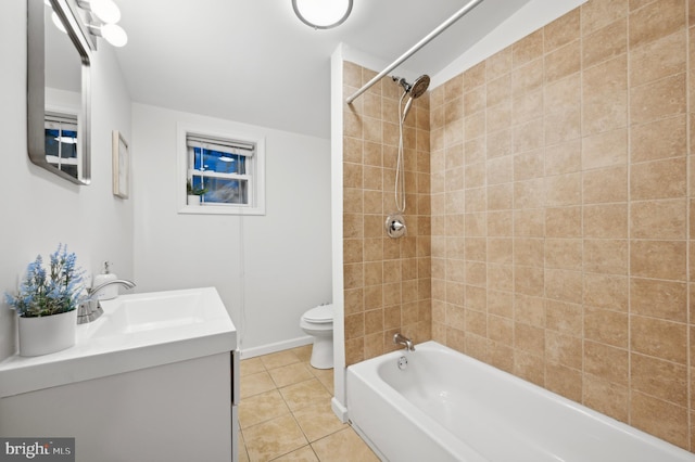 full bathroom with toilet, vanity, tiled shower / bath, and tile patterned flooring