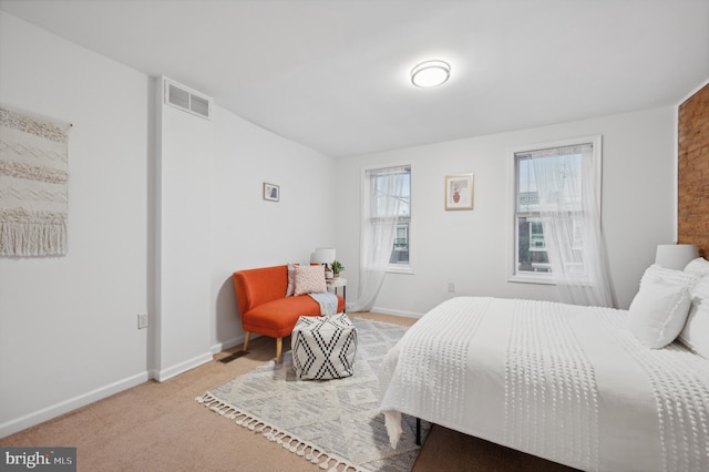 bedroom with light carpet