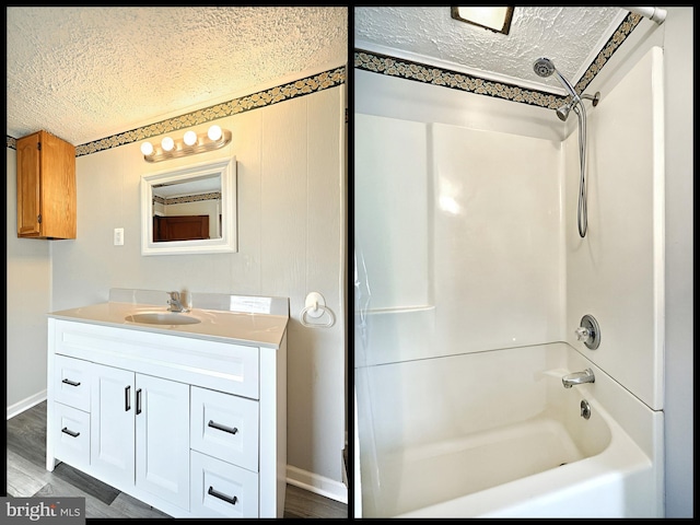 bathroom featuring vanity, wood-type flooring, shower / washtub combination, and a textured ceiling