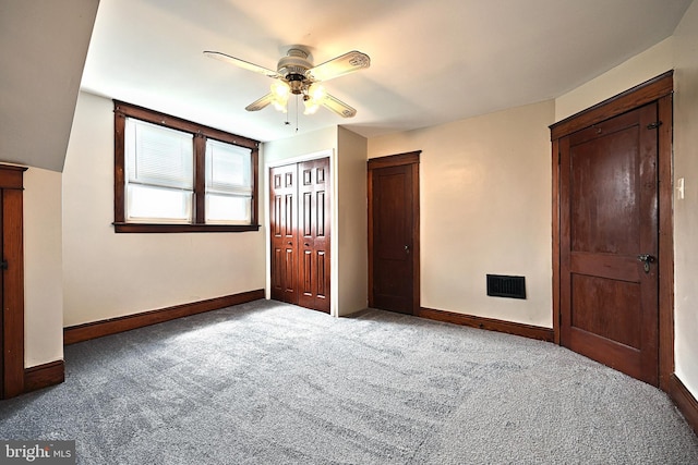 unfurnished bedroom with carpet flooring and ceiling fan