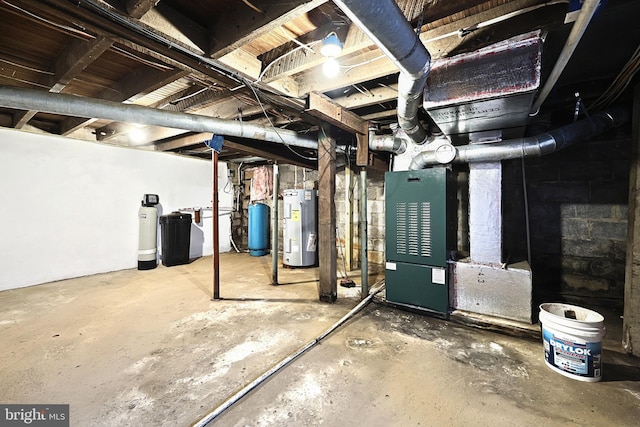 basement featuring heating unit and electric water heater