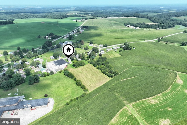 birds eye view of property with a rural view