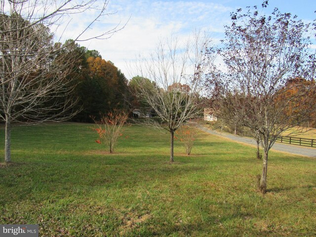 view of yard with a rural view