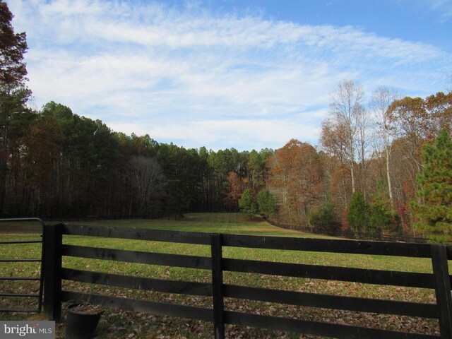 view of gate featuring a lawn