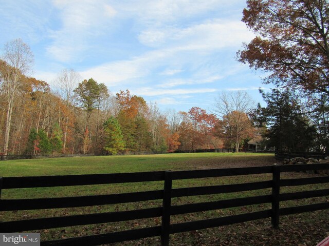 view of gate featuring a lawn