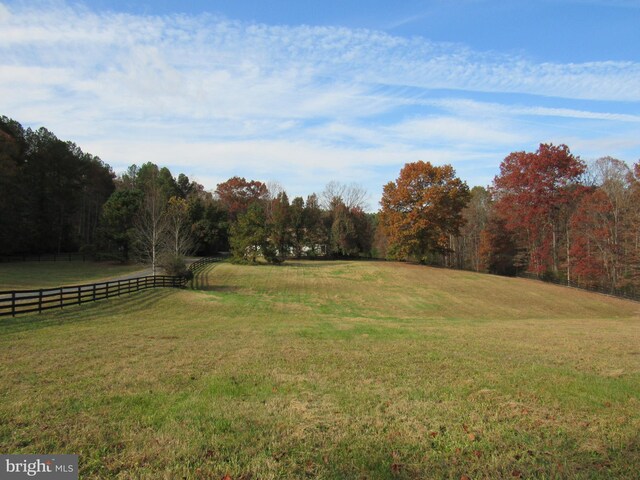 view of yard with a rural view