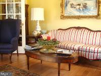 living area with hardwood / wood-style flooring