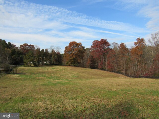 view of yard with a rural view